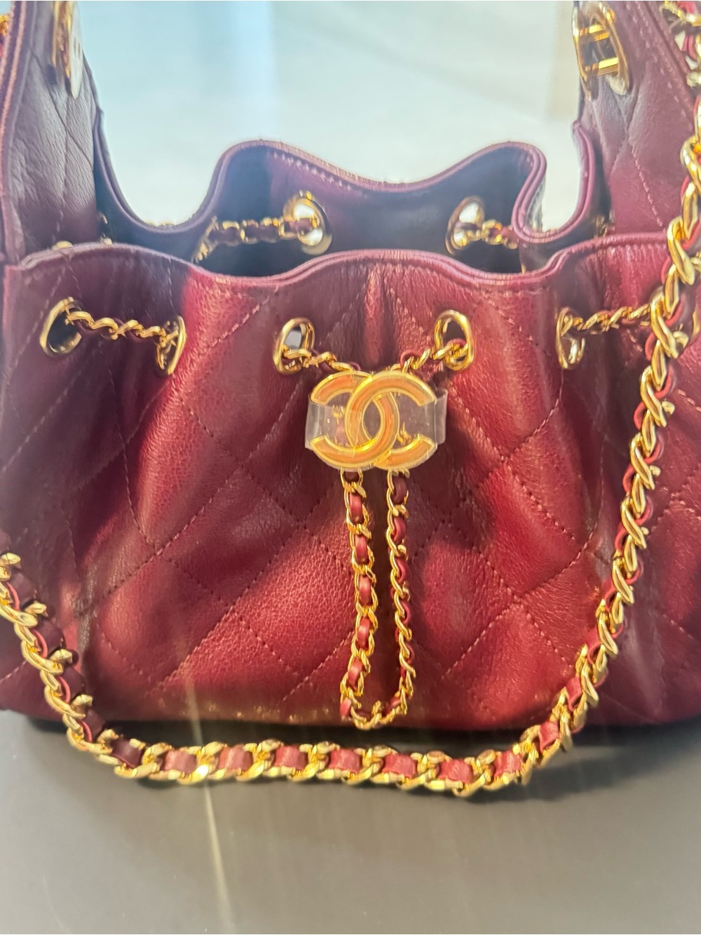 CHANEL Quilted Drawstring Shoulder Bag in Wine with Gold Hardware